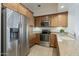 Well-equipped kitchen with stainless steel appliances and wooden cabinets at 3935 E Rough Rider Rd # 1264, Phoenix, AZ 85050
