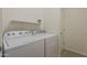 Laundry room featuring a white washer and dryer and an overhead shelf at 3935 E Rough Rider Rd # 1264, Phoenix, AZ 85050