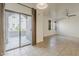 Bright living space boasts sliding glass doors to a patio and a view of neighborhood at 3935 E Rough Rider Rd # 1264, Phoenix, AZ 85050