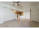 Open-concept living room showcases tile floors, neutral walls and flows into kitchen at 3935 E Rough Rider Rd # 1264, Phoenix, AZ 85050