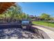 Outdoor patio area with built-in grill, stone counter, and beautiful view of the community at 3935 E Rough Rider Rd # 1264, Phoenix, AZ 85050