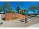 The Club at Aviano sign with desert landscaping, set against a clear blue sky at 3935 E Rough Rider Rd # 1264, Phoenix, AZ 85050