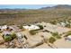 Expansive desert view with the property, RV parking, and nearby neighborhood at 40627 N 6Th Ave, Phoenix, AZ 85086