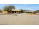 Spacious backyard with desert landscaping, covered patio, garden, and a view of the mountains at 40627 N 6Th Ave, Phoenix, AZ 85086
