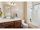 Bathroom featuring a wooden vanity with white sink, and a shower/tub combo with shower curtain at 40627 N 6Th Ave, Phoenix, AZ 85086