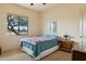Bedroom features a view of the desert landscape and neutral colors with a queen size bed at 40627 N 6Th Ave, Phoenix, AZ 85086