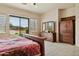 Bedroom with wooden furniture and slider door access at 40627 N 6Th Ave, Phoenix, AZ 85086