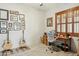 Study featuring a desk, acoustic guitars, shuttered windows, and decor at 40627 N 6Th Ave, Phoenix, AZ 85086