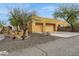 View of the home featuring the garage and desert landscaping at 40627 N 6Th Ave, Phoenix, AZ 85086