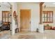Entryway with hardwood door, tile floor and architectural columns at 40627 N 6Th Ave, Phoenix, AZ 85086