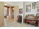 Inviting foyer with wood columns, adjacent rooms, tile floors, and homey decor at 40627 N 6Th Ave, Phoenix, AZ 85086