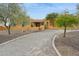 Charming desert home with gravel driveway and mature trees at 40627 N 6Th Ave, Phoenix, AZ 85086