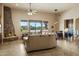 Open living space featuring a stone fireplace, dining area, and bar at 40627 N 6Th Ave, Phoenix, AZ 85086
