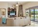 Cozy living room featuring a stone fireplace and lots of natural light at 40627 N 6Th Ave, Phoenix, AZ 85086