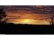 Sunset view showing the silhouettes of a mountain range and desert vegetation at 40627 N 6Th Ave, Phoenix, AZ 85086