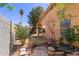 Outdoor space with charming garden, block wall, and vibrant foliage at 4450 E Amberwood Dr, Phoenix, AZ 85048