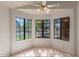 Cozy dining area with tiled flooring, a bay window, and a view of the front yard at 4450 E Amberwood Dr, Phoenix, AZ 85048