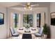 Cozy dining room featuring round table, modern chairs, and lots of natural light at 4450 E Amberwood Dr, Phoenix, AZ 85048