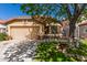 Charming single-story home with a two-car garage, desert landscaping, and a terracotta roof at 4450 E Amberwood Dr, Phoenix, AZ 85048