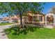 Charming single-story home with a well-manicured lawn, desert landscaping, and a terracotta roof at 4450 E Amberwood Dr, Phoenix, AZ 85048