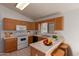 Cozy kitchen featuring modern appliances, breakfast bar, and lots of natural light at 4450 E Amberwood Dr, Phoenix, AZ 85048