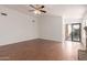 The open living room features wood-look tile flooring and a sliding glass door at 4450 E Amberwood Dr, Phoenix, AZ 85048
