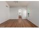 Large main bedroom with wood-look floors, a ceiling fan, and an ensuite bathroom at 4450 E Amberwood Dr, Phoenix, AZ 85048