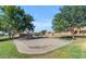 Sand volleyball court surrounded by lush landscaping and common area at 4450 E Amberwood Dr, Phoenix, AZ 85048