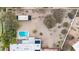 Bird's eye view of a modern home with pool, solar panels, and desert landscaping at 5033 E Turquoise Ave, Paradise Valley, AZ 85253