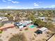Aerial view of a modern home with a pool, separate guest house and desert landscaping at 5033 E Turquoise Ave, Paradise Valley, AZ 85253