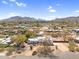 Stunning aerial view of a modern home with mountain views and desert landscaping at 5033 E Turquoise Ave, Paradise Valley, AZ 85253