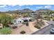 Expansive home with desert landscaping, mountain views, and a modern architectural design at 5033 E Turquoise Ave, Paradise Valley, AZ 85253
