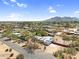 Aerial view of a neighborhood with desert landscaping and mountain views at 5033 E Turquoise Ave, Paradise Valley, AZ 85253