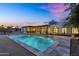 Wonderful backyard with a refreshing pool, modern patio and a beautifully designed home at sunset at 5033 E Turquoise Ave, Paradise Valley, AZ 85253