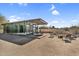 Modern backyard with gravel landscaping, outdoor seating, and a clear view of the home's architecture at 5033 E Turquoise Ave, Paradise Valley, AZ 85253