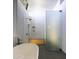 Modern bathroom featuring a glass shower, white tiles, and a soaking tub at 5033 E Turquoise Ave, Paradise Valley, AZ 85253