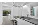 Bathroom with modern gray countertops, sink, and walk out door at 5033 E Turquoise Ave, Paradise Valley, AZ 85253
