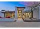 Stylish modern home with desert landscaping and a sleek entryway and modern front door at 5033 E Turquoise Ave, Paradise Valley, AZ 85253