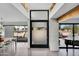 Open concept entryway features tile floors, frosted glass front door and modern touches at 5033 E Turquoise Ave, Paradise Valley, AZ 85253