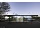Modern glass home with sleek lines and minimalist landscaping at 5033 E Turquoise Ave, Paradise Valley, AZ 85253