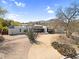 Modern home with desert landscaping, circular driveway and mountain views at 5033 E Turquoise Ave, Paradise Valley, AZ 85253