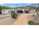 Aerial view of modern home featuring desert landscaping, mountain views, and clean architectural lines at 5033 E Turquoise Ave, Paradise Valley, AZ 85253
