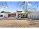 Modern home exterior with clean lines, desert landscaping, and large windows at 5033 E Turquoise Ave, Paradise Valley, AZ 85253