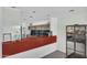 Stylish kitchen featuring modern cabinets, stainless steel appliances, and a sleek breakfast bar at 5033 E Turquoise Ave, Paradise Valley, AZ 85253