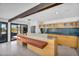 Modern kitchen features a stainless steel island, breakfast bar, and sleek appliances at 5033 E Turquoise Ave, Paradise Valley, AZ 85253