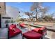 Spacious patio offering comfortable red seating, a stylish glass table, and ample outdoor space at 5033 E Turquoise Ave, Paradise Valley, AZ 85253