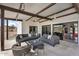 Spacious outdoor living area featuring comfortable seating and seamless access to the indoors via sliding doors at 5033 E Turquoise Ave, Paradise Valley, AZ 85253
