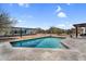 Backyard featuring a pool with a baja step, desert landscaping, and mountain views in the background at 5033 E Turquoise Ave, Paradise Valley, AZ 85253