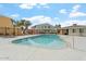 Large community swimming pool with a diving board and lounge area at 510 N Alma School N Rd # 158, Mesa, AZ 85201