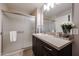 This bathroom features a spacious shower with glass doors and a modern vanity at 5450 E Deer Valley Dr # 1186, Phoenix, AZ 85054
